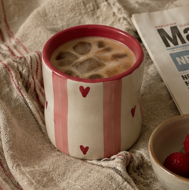 coffee mug with pink stripes and heart details